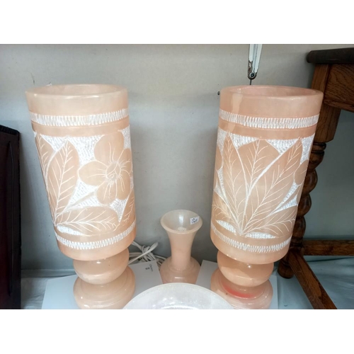 23 - A good selection of pink alabaster including a pair of table lamps, comport, vases and trinket pot C... 