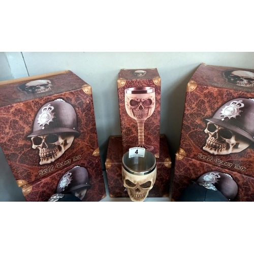 4 - 4 boxed gothic skull/police money boxes, 1 skull money box and a goblet