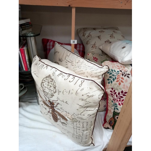 40 - A good lot of cushions, including bees, owls, hares etc