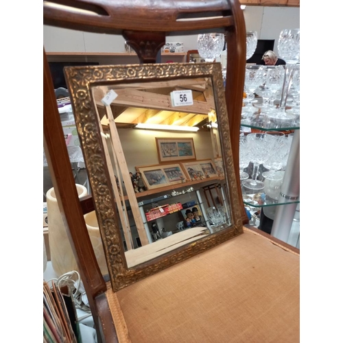 56 - A brass framed mirror 18cm x 34cm