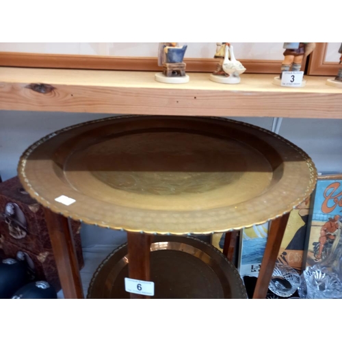 6 - A 2 tiered brass tray/table on wooden legs height 54cm, diameter of top tray 51cm COLLECT ONLY