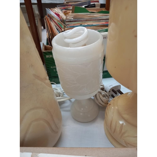 69 - A pair of polished alabaster table lamps plus 2 others and a vase COLLECT ONLY