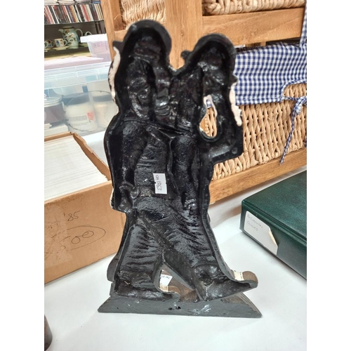 74 - A cast metal Laurel and Hardy door stop