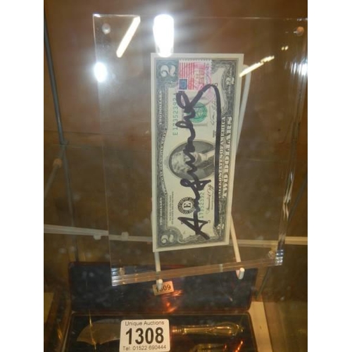 An Andy Warhol signed two dollar note with USA chemistry stamp in perspex  frame with certificate of