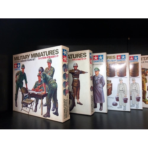 108 - A quantity of boxed Tamiya 1/35 military miniatures soldiers and road sign sets unchecked