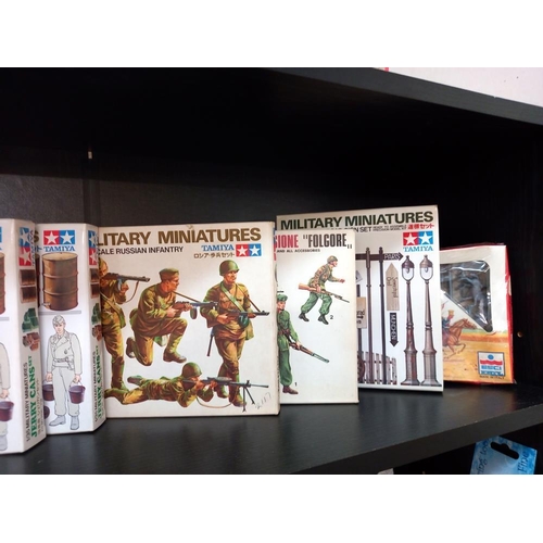 108 - A quantity of boxed Tamiya 1/35 military miniatures soldiers and road sign sets unchecked