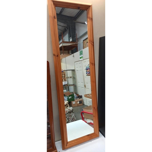 113 - A tall pine framed mirror, Approx measurements 135cm x 42cm COLLECT ONLY