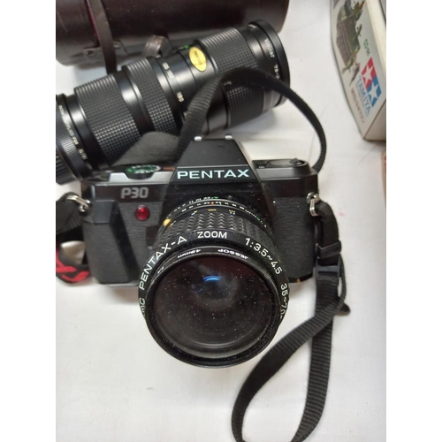 116 - A Pentax P30 camera with a Vivitar lens