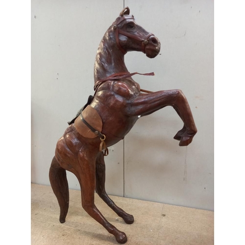 122 - 2 leather horses