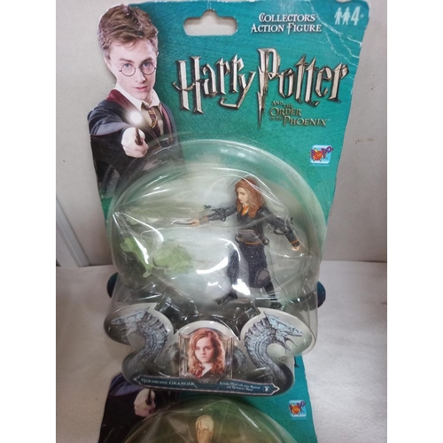 135 - 4 Harry Potter figures sealed in bubble packs and some collectors cards