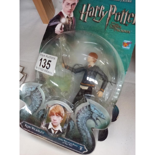 135 - 4 Harry Potter figures sealed in bubble packs and some collectors cards