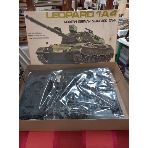 142 - 2 Tamiya and 1 Revell military vehicle model kits all bagged and sealed