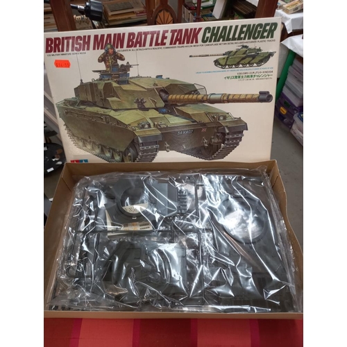 142 - 2 Tamiya and 1 Revell military vehicle model kits all bagged and sealed