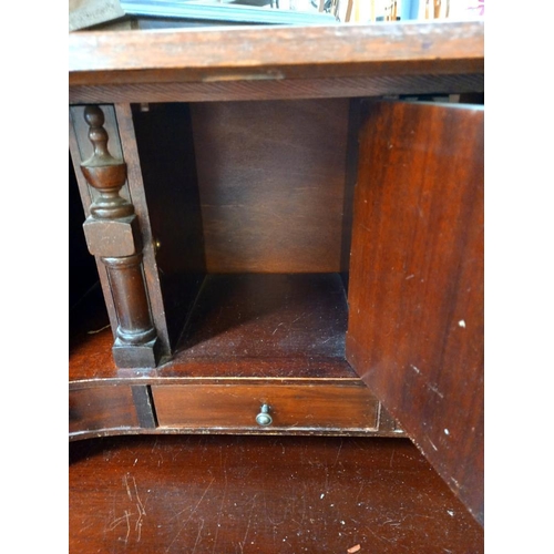 149 - A mahogany bureau with serpentine front and ball and claw legs COLLECT ONLY