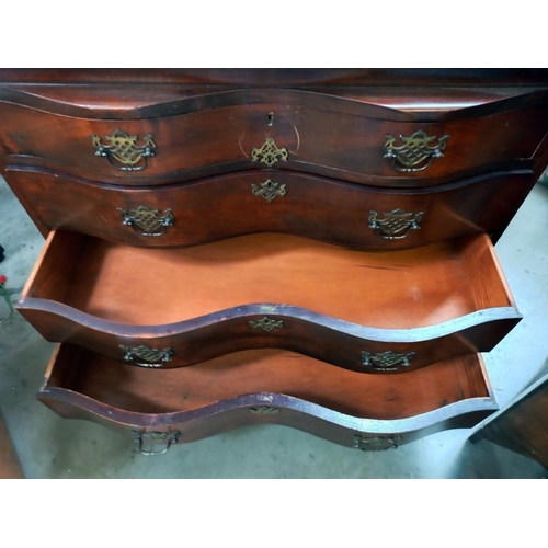 149 - A mahogany bureau with serpentine front and ball and claw legs COLLECT ONLY