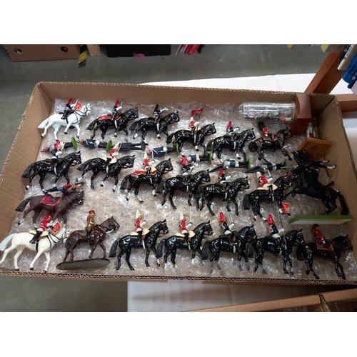 83 - A large quantity of Britain's soldiers (re-painted) and some empty boxes