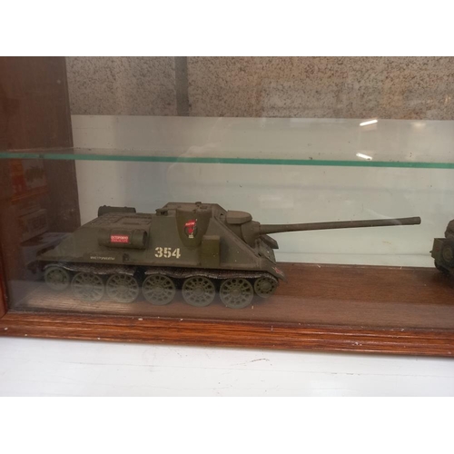 184 - A model display cabinet with 2 plastic military models COLLECT ONLY