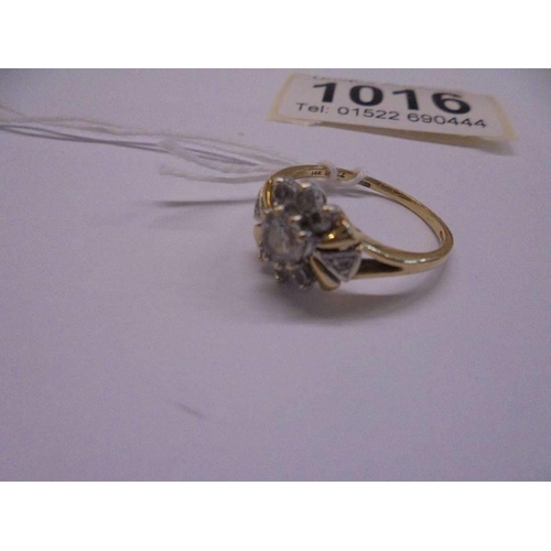 1016 - A yellow gold cluster ring, marked 10k, size Q, 3.2 grams.