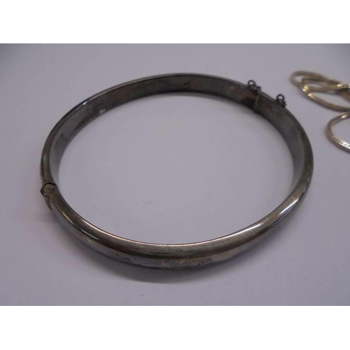 1022 - A silver bangle and a silver ingot on silver chain, 17.2 grams.