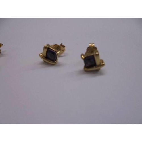 1026 - Two pairs of 9ct gold earrings (4 grams) and a pair of yellow metal earrings.