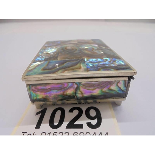 1029 - An Alpaca  Mexico white metal pill box, inlaid with mother of pearl abalone shell.