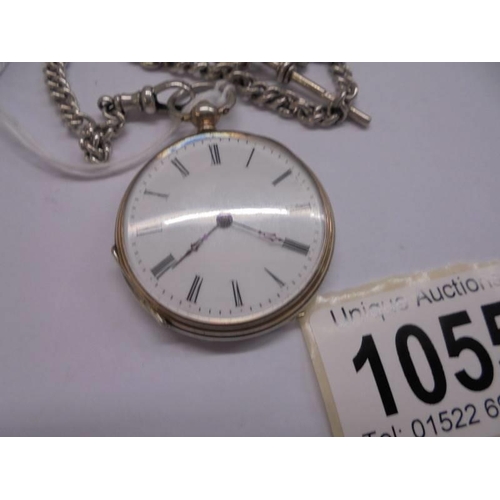 1055 - A Victorian ladies silver fob watch on silver chain, in working order, (chain 21 grams).