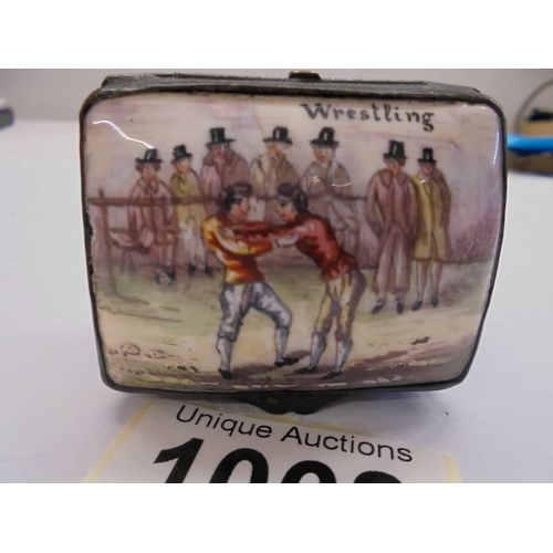 1068 - An early Victorian enamel patch box featuring a wrestling scene, 5 x 4 x 3 cm.