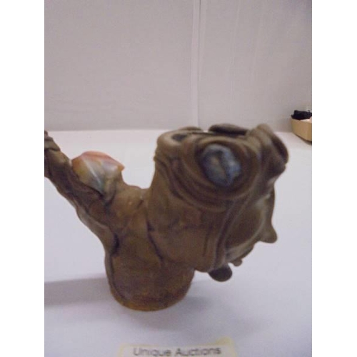 1070 - An unusual vintage pottery pipe of a head impressed with coloured stones.