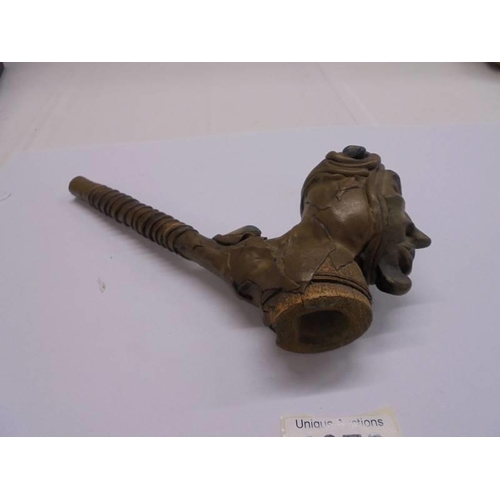 1070 - An unusual vintage pottery pipe of a head impressed with coloured stones.