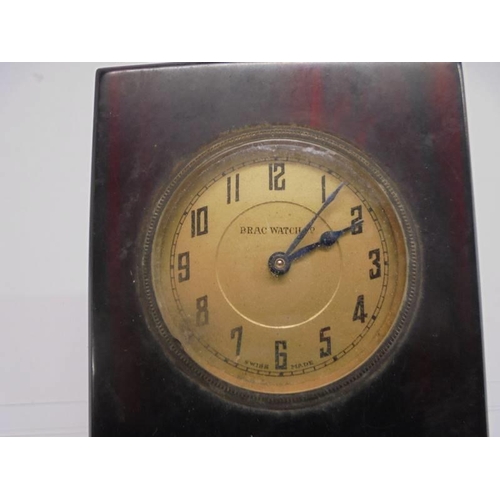 1075 - A vintage bakelite Hotel Royal Rome desk paperclip with integral clock.