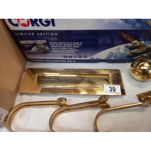 39 - A quantity of brass fixtures and fittings including door knocker