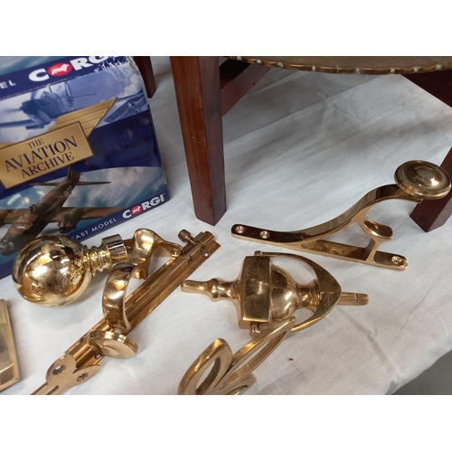 39 - A quantity of brass fixtures and fittings including door knocker