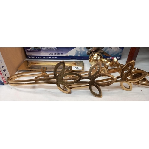 39 - A quantity of brass fixtures and fittings including door knocker