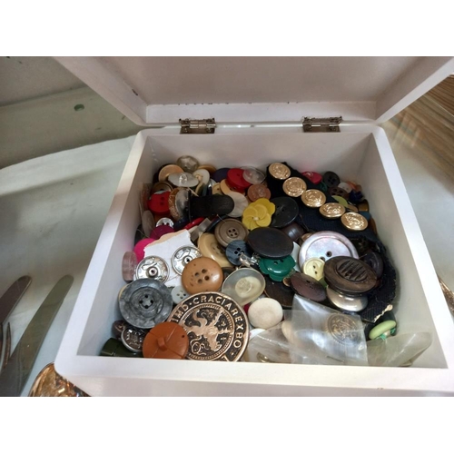 77 - A sewing box with cotton reels and a box of buttons