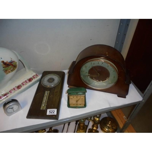 522 - A ceramic clock case, a mantel clock, a barometer and two other clocks. COLLECT ONLY.