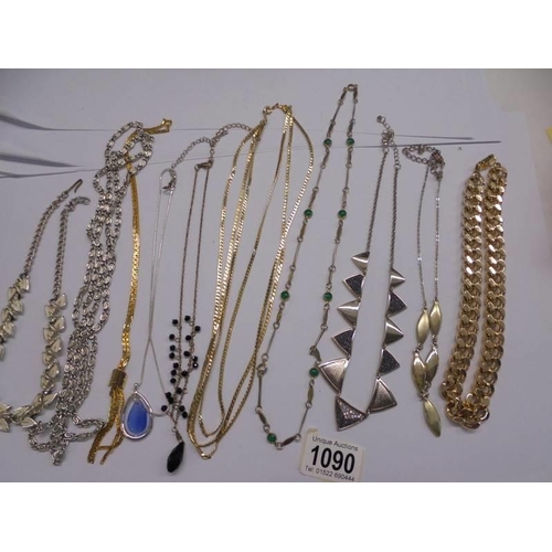 1090 - Ten white and yellow metal necklaces.