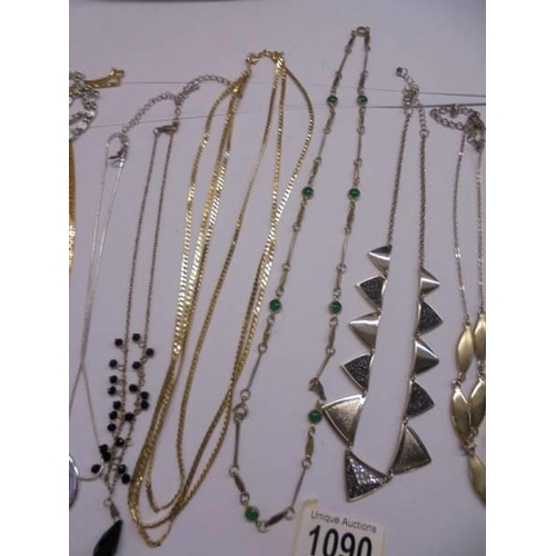 1090 - Ten white and yellow metal necklaces.