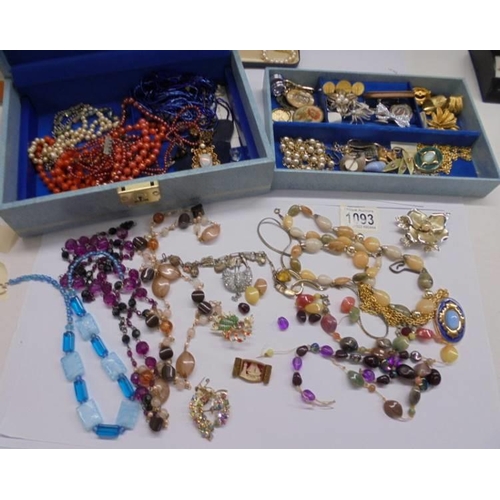 1093 - A jewellery box containing necklaces, brooches, watches etc.,