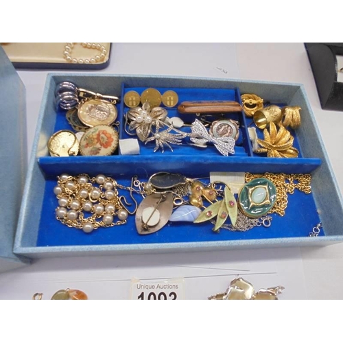 1093 - A jewellery box containing necklaces, brooches, watches etc.,