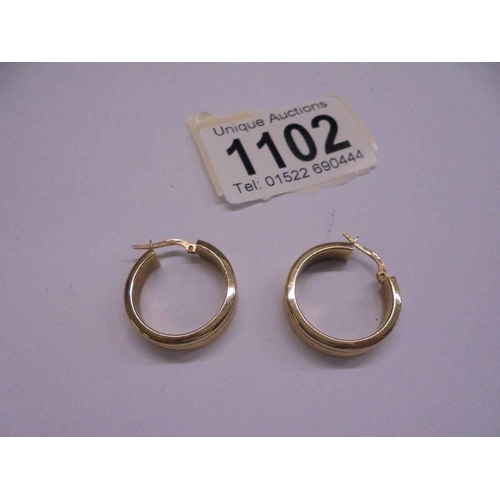 1102 - A pair of 9ct gold earrings, 3.3 grams.