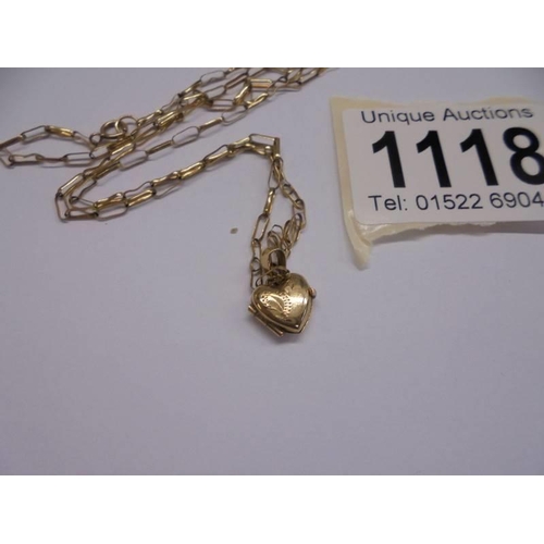 1118 - A 9ct gold heart locket on chain, 2 grams.