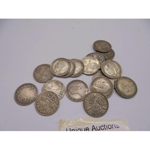 1122 - Approximately nineteen silver threepenny bits, 25.9 grams.