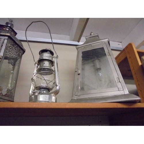 531 - A hurricane lamp and three lanterns, COLLECT ONLY.