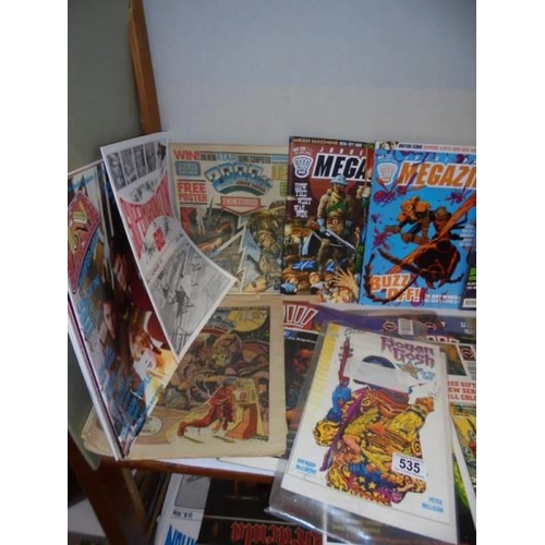 535 - Two shelves of assorted comics and magazines.