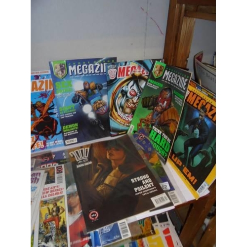 535 - Two shelves of assorted comics and magazines.