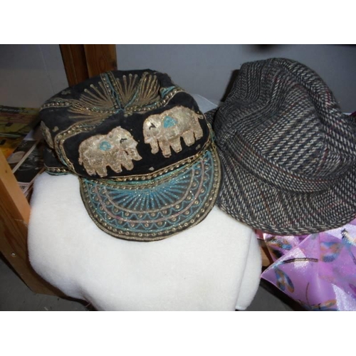 540 - A mixed lot of hats, scarves, neck ties etc.,