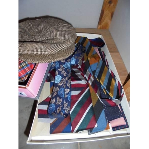 540 - A mixed lot of hats, scarves, neck ties etc.,