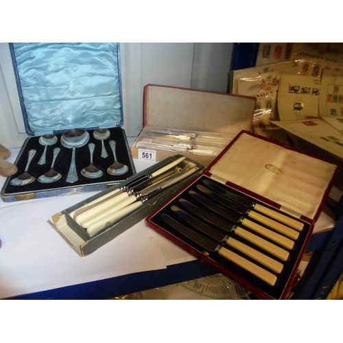 561 - A quantity of cased and other cutlery sets.