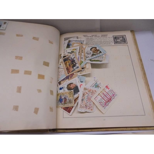 1127 - Two albums of world stamps and a quantity of first day covers.