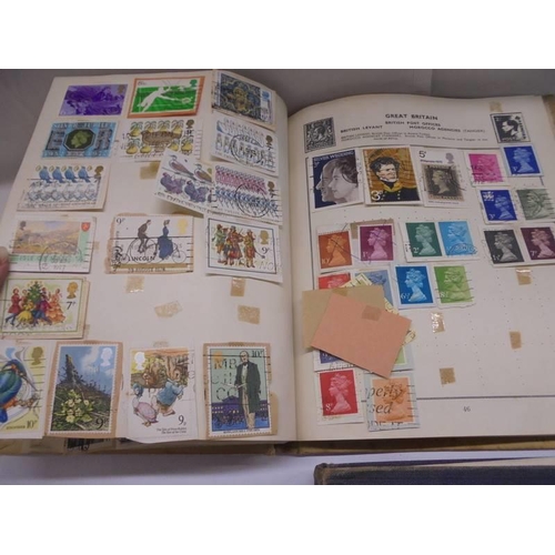 1127 - Two albums of world stamps and a quantity of first day covers.